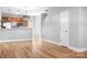 Open-concept living space features wood floors and a seamless transition to the kitchen at 12417 Mcgrath Dr, Charlotte, NC 28269
