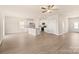 Spacious living room with hardwood floors flowing into an open-concept kitchen at 125 Lightning Dr, Shelby, NC 28152