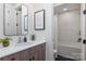 Charming bathroom showcases shaker cabinets, modern fixtures, and a tub-shower combination at 13217 Oak Farm Ln, Huntersville, NC 28078