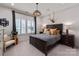 Cozy bedroom offers a dark wood furniture set, woven lighting fixture, and an inviting ambiance at 13217 Oak Farm Ln, Huntersville, NC 28078