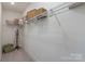 Walk-in closet featuring ample shelving, clothing racks, and storage space is perfect for organization and storage at 13217 Oak Farm Ln, Huntersville, NC 28078