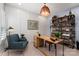 Inviting home office with custom shelving, a modern desk, and comfortable seating at 13217 Oak Farm Ln, Huntersville, NC 28078