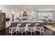 Spacious kitchen with barstool seating, pendant lighting, white cabinetry, and stainless steel appliances at 13217 Oak Farm Ln, Huntersville, NC 28078