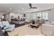 Spacious living room with a plush sofa, modern decor, and seamless flow to the kitchen area at 13217 Oak Farm Ln, Huntersville, NC 28078