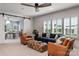 Spacious living room with comfortable seating and large windows providing natural light at 13217 Oak Farm Ln, Huntersville, NC 28078