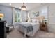 Spacious main bedroom featuring stylish decor and a large window with shutters at 13217 Oak Farm Ln, Huntersville, NC 28078