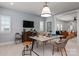 Well appointed office features designer accents, including a modern desk, storage cabinet, and neutral color palette at 13217 Oak Farm Ln, Huntersville, NC 28078