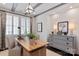 Bright home office with a wooden desk, comfortable chairs, and stylish decor at 13217 Oak Farm Ln, Huntersville, NC 28078