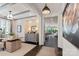 Bright home office with modern furnishings, large windows, and stylish decor at 13217 Oak Farm Ln, Huntersville, NC 28078