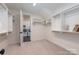 Large walk-in closet with custom built-ins leading to laundry room with new washer and dryer at 13217 Oak Farm Ln, Huntersville, NC 28078
