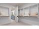 Bright walk-in closet with custom shelving and storage, leading to an ensuite bathroom at 13217 Oak Farm Ln, Huntersville, NC 28078