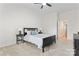 Inviting bedroom with a comfortable bed, neutral carpet, and a ceiling fan for added comfort at 1347 Eisenhower Nw Pl, Concord, NC 28027