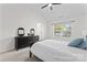 Bright bedroom featuring a large bed, dresser, and a window with a view to the outdoors at 1347 Eisenhower Nw Pl, Concord, NC 28027