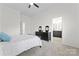 Comfortable bedroom featuring a large bed, ceiling fan, and an en-suite bathroom at 1347 Eisenhower Nw Pl, Concord, NC 28027