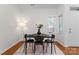Cozy dining room featuring a modern table, stylish decor, and ample natural light at 1347 Eisenhower Nw Pl, Concord, NC 28027