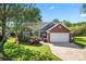 Charming one-story home featuring brick and siding with a two-car garage and beautiful landscaping at 1347 Eisenhower Nw Pl, Concord, NC 28027