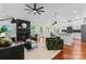 Bright and airy living room with hardwood floors, fireplace, and an open floor plan at 1347 Eisenhower Nw Pl, Concord, NC 28027