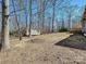 Large backyard features a charming shed with trees around the border at 1525 Autumn Brook Ln # 78, York, SC 29745