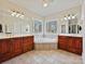 Bathroom features a corner soaking tub with dual vanities and large windows at 1525 Autumn Brook Ln # 78, York, SC 29745