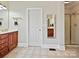 Bathroom with tiled floors, wood vanity, framed mirror, and walk-in shower at 1525 Autumn Brook Ln # 78, York, SC 29745