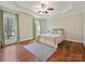The bedroom features wood floors, natural light, and neutral decor, creating a serene and inviting atmosphere at 1525 Autumn Brook Ln # 78, York, SC 29745