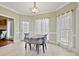 A charming dining area features a table with seating and is surrounded by windows and natural light at 1525 Autumn Brook Ln # 78, York, SC 29745