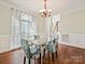 Bright dining area featuring hardwood flooring, modern lighting, and large windows at 1525 Autumn Brook Ln # 78, York, SC 29745