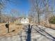 Long driveway leads to a two-car garage in this wooded lot at 1525 Autumn Brook Ln # 78, York, SC 29745