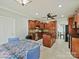 A well-lit kitchen showcases wood cabinets, modern appliances, tile flooring, and an eat-in dining area at 1525 Autumn Brook Ln # 78, York, SC 29745