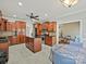 A kitchen features wooden cabinets, stainless steel appliances, granite countertops, an island, and an adjacent seating area at 1525 Autumn Brook Ln # 78, York, SC 29745