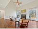The living room features a fireplace, tall ceilings, natural light, hardwood floors, and comfortable seating at 1525 Autumn Brook Ln # 78, York, SC 29745