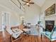 A living room features tall ceilings, a fireplace, and ample seating, creating a cozy and inviting atmosphere at 1525 Autumn Brook Ln # 78, York, SC 29745