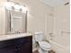 The bathroom has a vanity with sink, a mirror, a toilet, and a tub and shower combo at 1606 Eagles Pl # J101, Rock Hill, SC 29732
