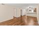 Open living area with hardwood floors, neutral walls, and access to additional rooms and storage at 1606 Eagles Pl # J101, Rock Hill, SC 29732