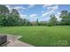 Expansive and well-manicured lawn, enclosed by a fence, offering a serene outdoor space at 16308 Poplar Tent Rd, Huntersville, NC 28078