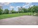 Fenced backyard features a spacious concrete patio and lush lawn, ideal for outdoor activities at 16308 Poplar Tent Rd, Huntersville, NC 28078
