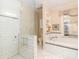 Modern bathroom showcases a walk-in shower, soaking tub, and elegant fixtures in a bright space at 17109 Cabarrus Rd, Midland, NC 28107