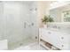 Bright bathroom featuring a glass shower, white vanity, and marble countertop at 17109 Cabarrus Rd, Midland, NC 28107