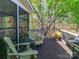 Serene deck with comfortable seating and scenic tree views; perfect for relaxing at 17109 Cabarrus Rd, Midland, NC 28107