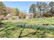 Exterior yard with garden, shed, and mature trees at 17109 Cabarrus Rd, Midland, NC 28107
