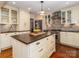 Spacious kitchen with an island, stainless steel appliances, and ample storage at 17109 Cabarrus Rd, Midland, NC 28107