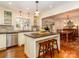 Kitchen island with seating and stainless appliances, flows into the dining room at 17109 Cabarrus Rd, Midland, NC 28107