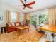 Comfortable sunroom with large windows, natural light, and stylish furnishings at 17109 Cabarrus Rd, Midland, NC 28107