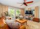 Relaxing sunroom featuring an area rug and lots of natural light from the window at 17109 Cabarrus Rd, Midland, NC 28107