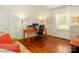 Comfortable office space with hardwood floors, natural light, and functional furniture at 17109 Cabarrus Rd, Midland, NC 28107