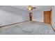 This spacious bedroom features plush carpeting and a classic ceiling fan at 1921 Wexford Ct, Gastonia, NC 28054