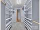 Spacious walk-in closet featuring custom built-in shelving and ample storage at 1921 Wexford Ct, Gastonia, NC 28054