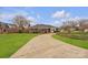 Beautiful brick home with a long driveway and lush landscaping at 1921 Wexford Ct, Gastonia, NC 28054