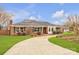 Charming brick home featuring a manicured front lawn and a curved driveway at 1921 Wexford Ct, Gastonia, NC 28054