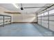 The garage features painted floors, painted walls, a garage door opener, and shelving at 1921 Wexford Ct, Gastonia, NC 28054